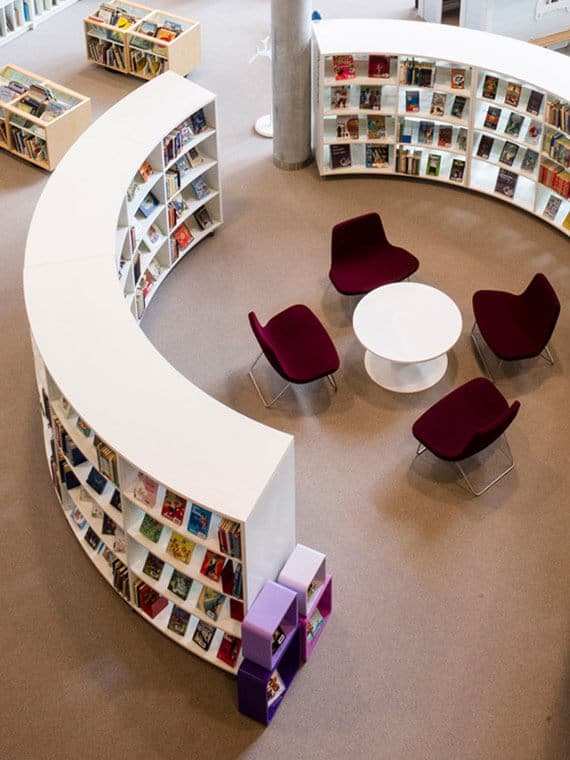 View looking down at a curved shelving system